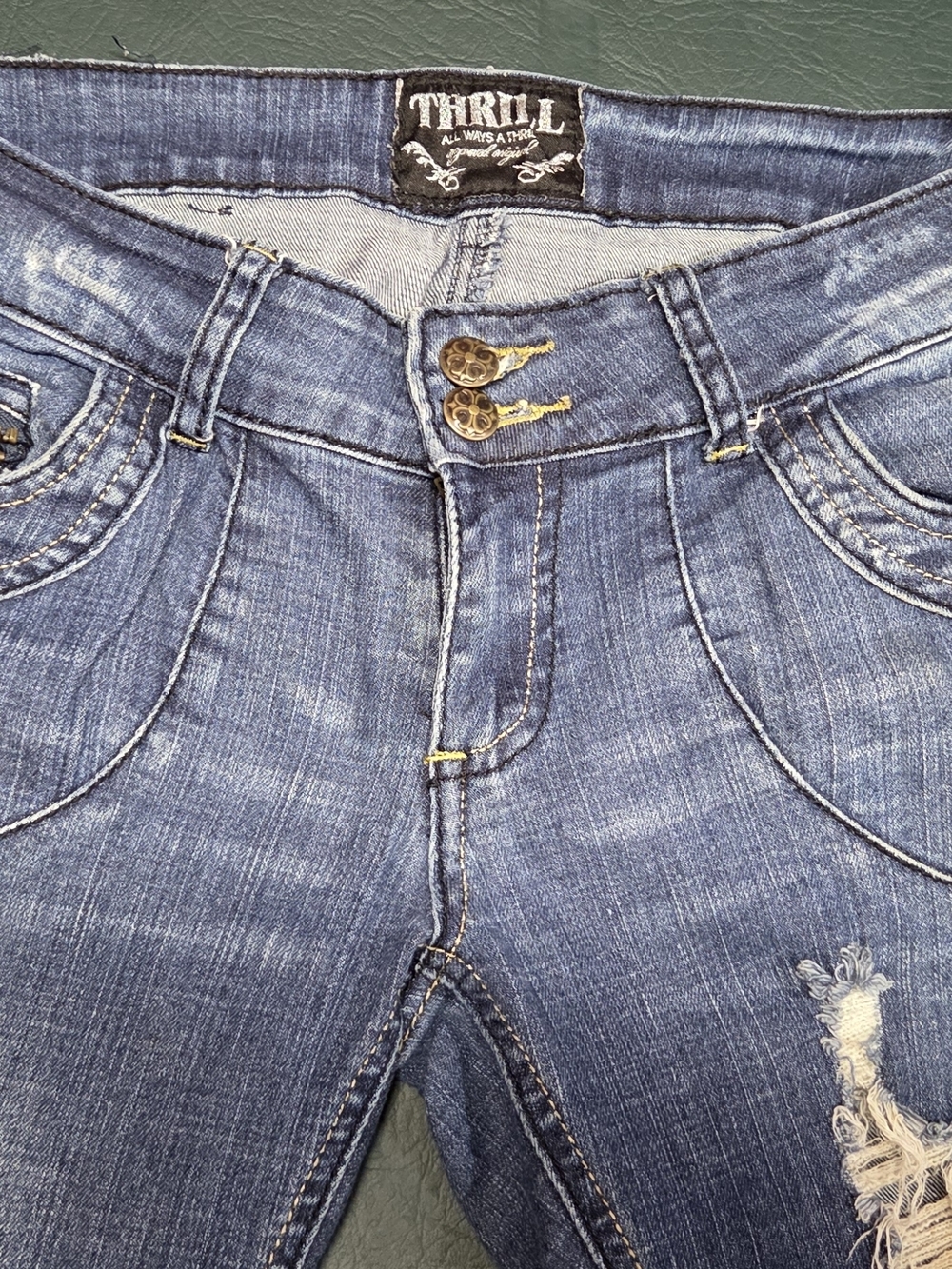 **Women’s Skinny Distressed Blue Jeans with Burgundy Patch Details** - Picture 8 of 11